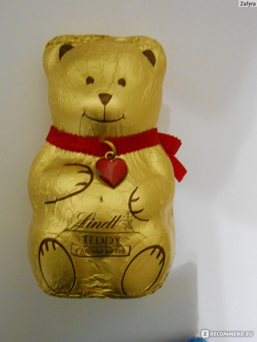 Шоколадный медведь lindt. Шоколадный мишка Lindt Teddy. Шоколадный медведь Линдт. Шоколадный мишка упакован в сферу. Мишки витамины из шоколада.